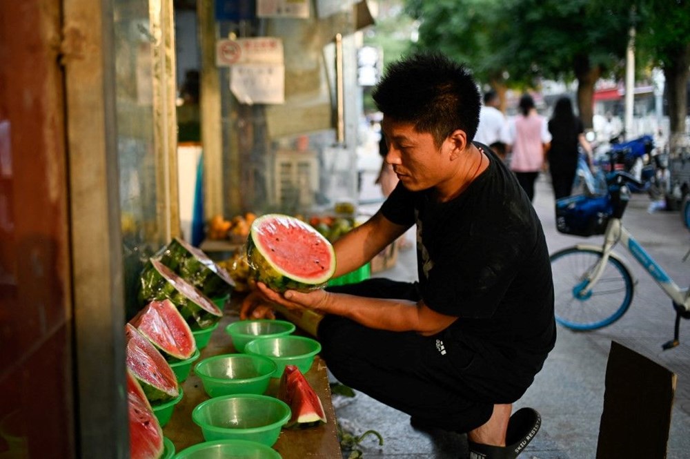 Çin'de emlak krizi: Müteahhitler karpuz, sarımsak ve şeftali karşılığında ev satmaya başladı - 1