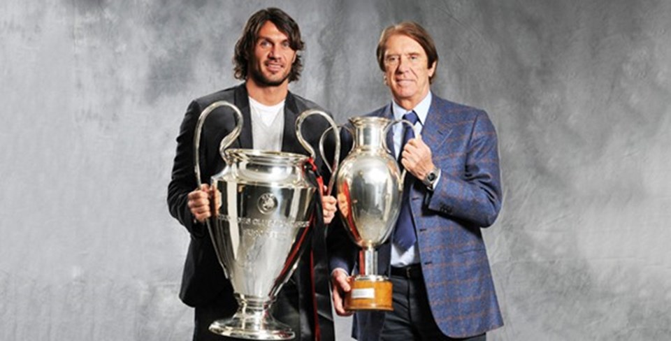 Paolo Maldini ve Cesare Maldini kazandıkları Şampiyonlar Ligi kupalarıyla birlikte
