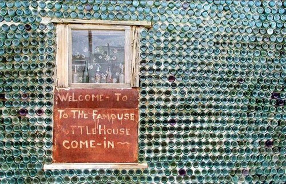 This house was being painted. A House made out of Bottles.