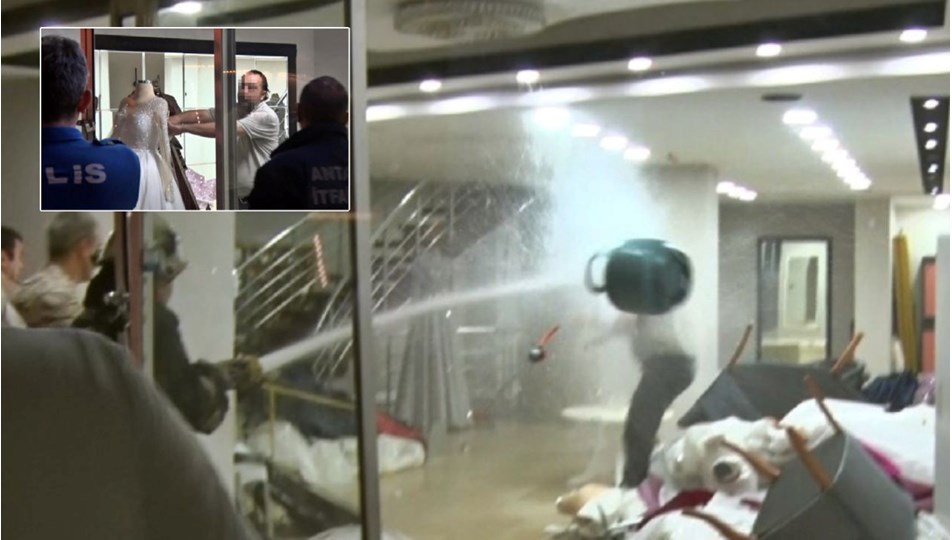 Eşinin mağazasını basıp gelinlikleri yakmaya çalıştı: Tazyikli suyla durdurdular!