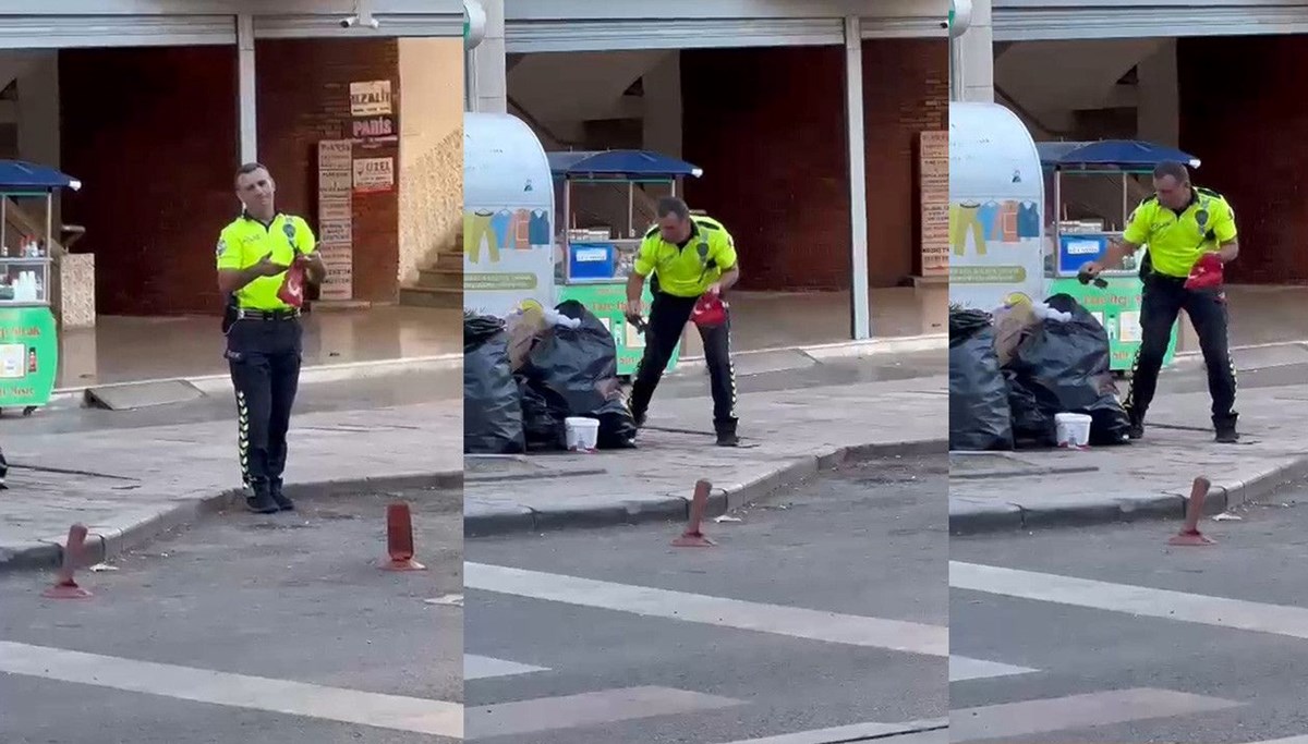 Trafik polisi çöpte bulduğu Türk bayrağını çıkartıp temizledi