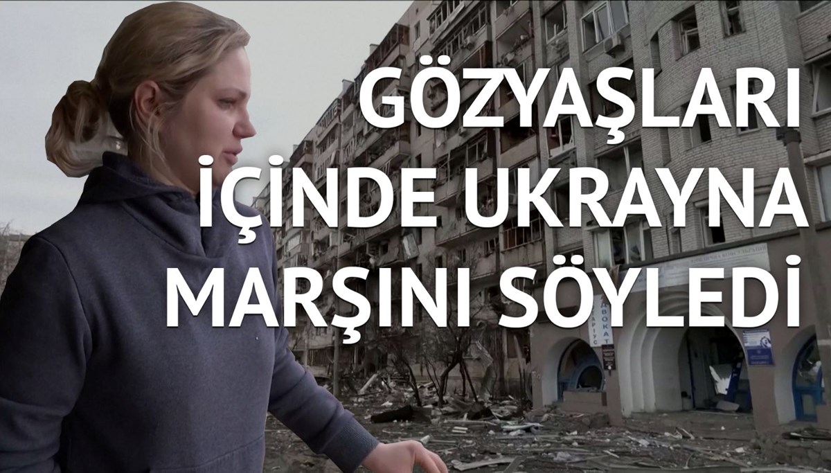 Bombaların kırdığı camları marş söyleyerek temizledi