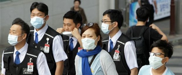 150603081410_south_korean_with_masks_mers_624x351_getty.jpg