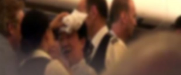 Uçakta 'açık telefon' kavgası